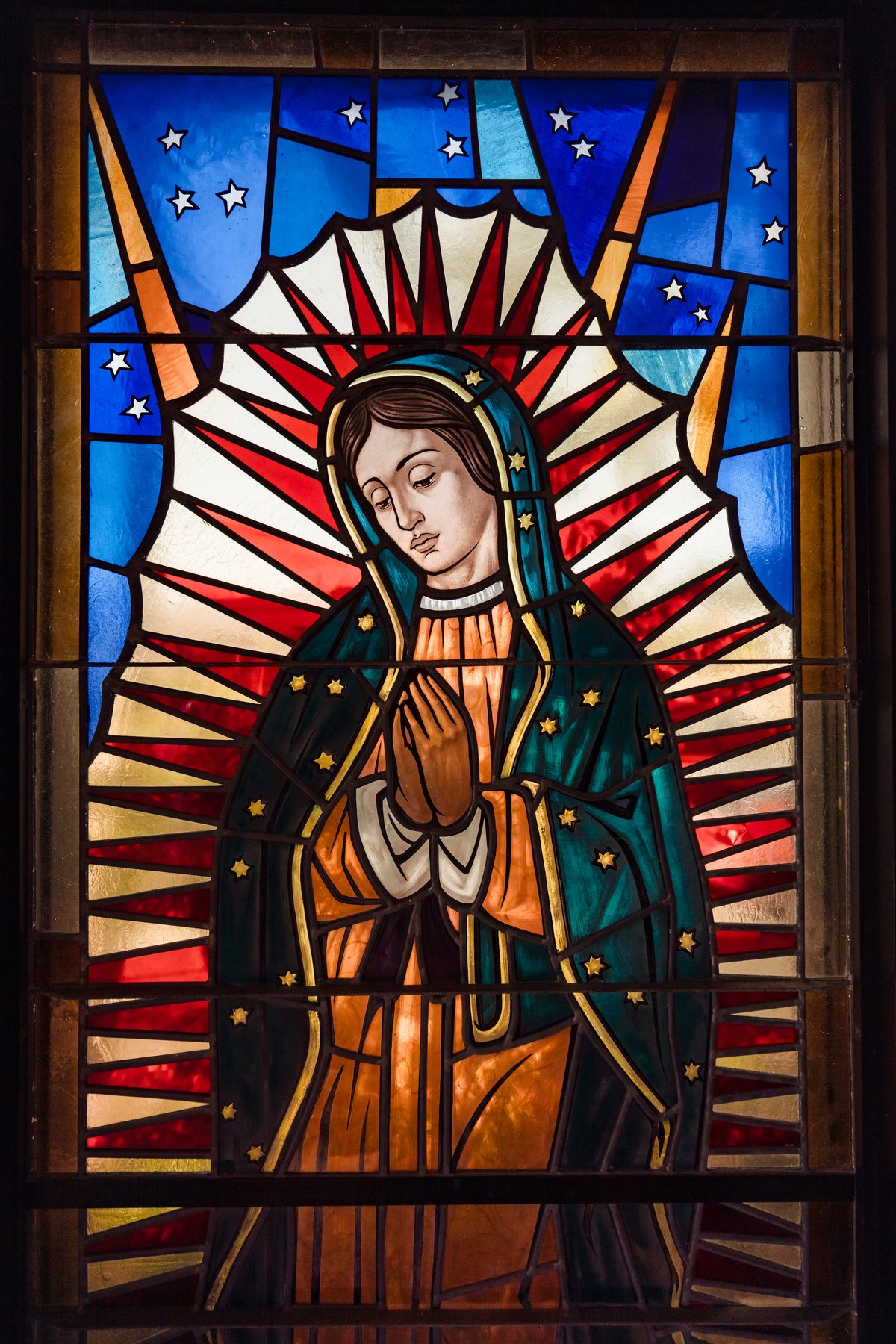 Stained-glass window of Our Lady of Guadalupe at the parish in Hermosa Beach