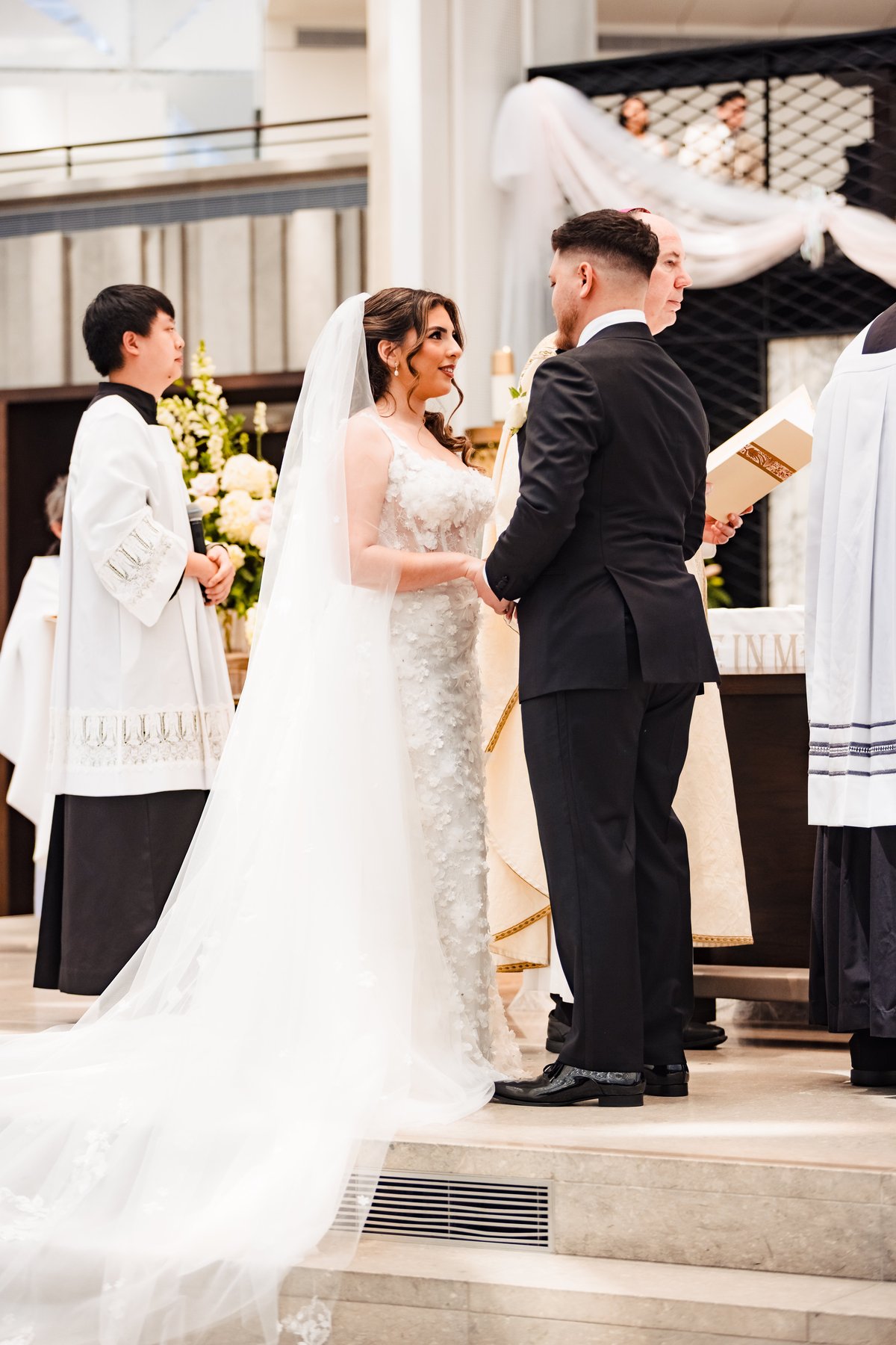 The exchange of vows during the Nuptial Mass at Christ Cathedral, Garden Grove