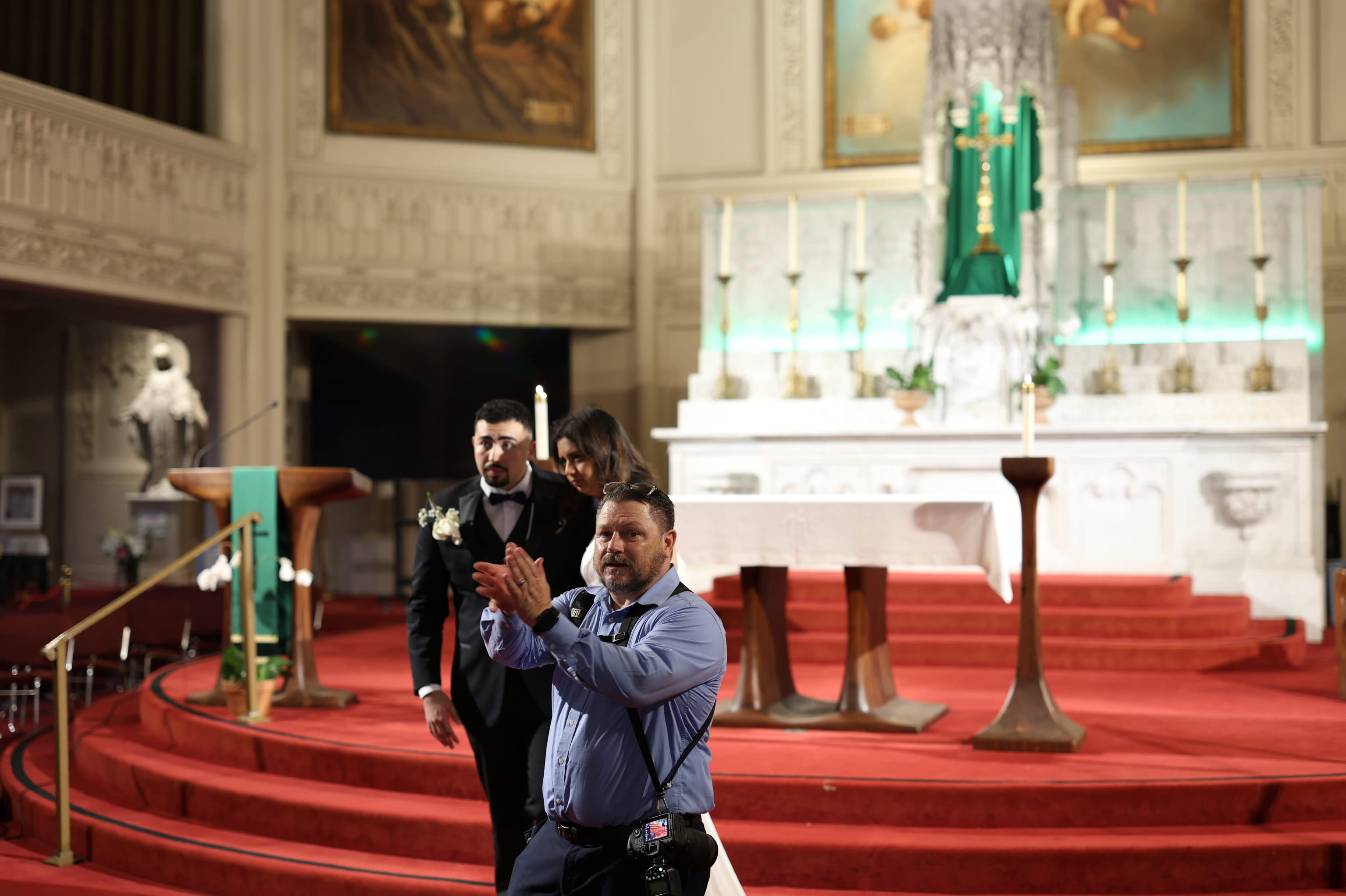William J. Saylor photographing a Catholic wedding Mass