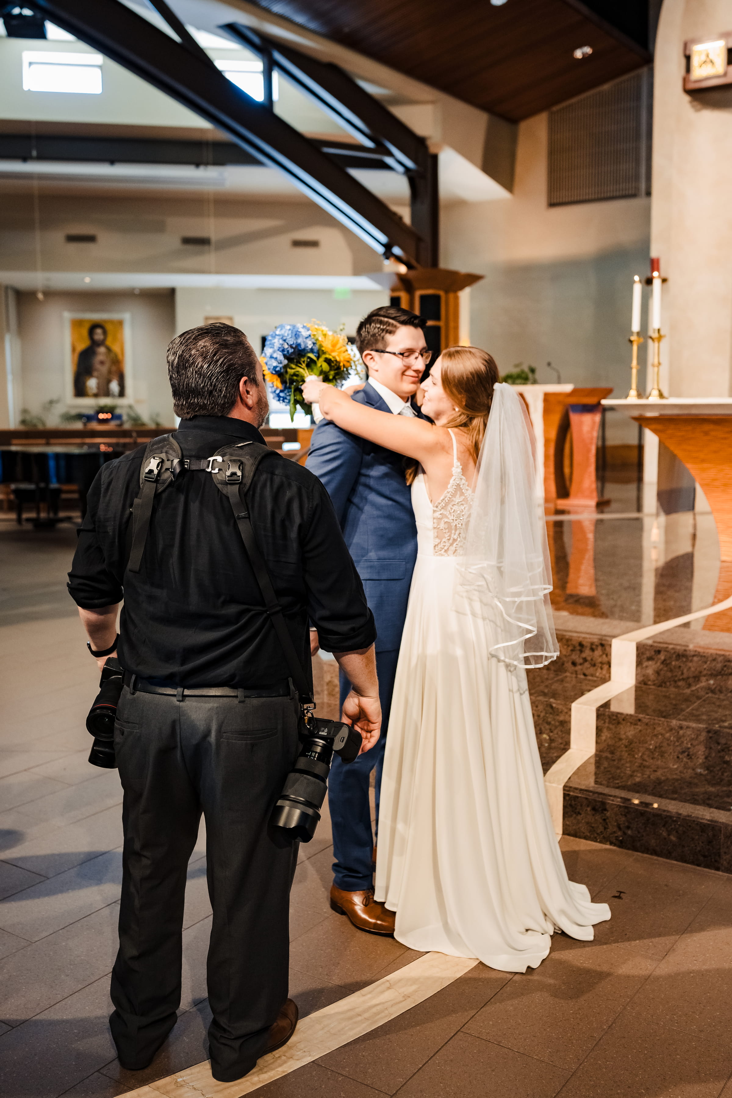 William J. Saylor directing a couple at their wedding