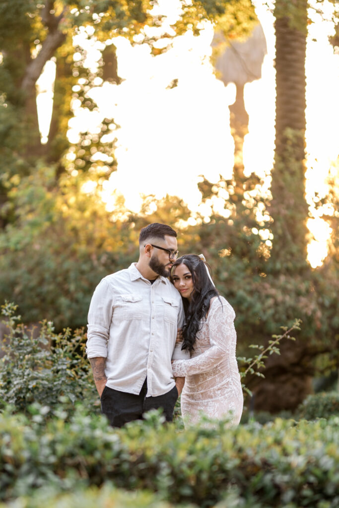 Engaged couple embracing each other during sunset in Redlands California