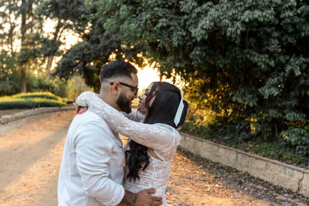Romantic couple on the dirt walkway at Prospect park Redlands