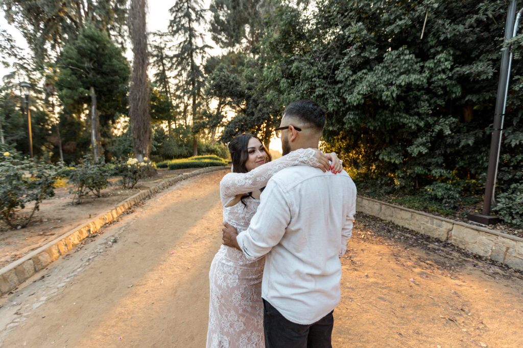Couple having a romantic moment in the warm sunset at Prospect Park