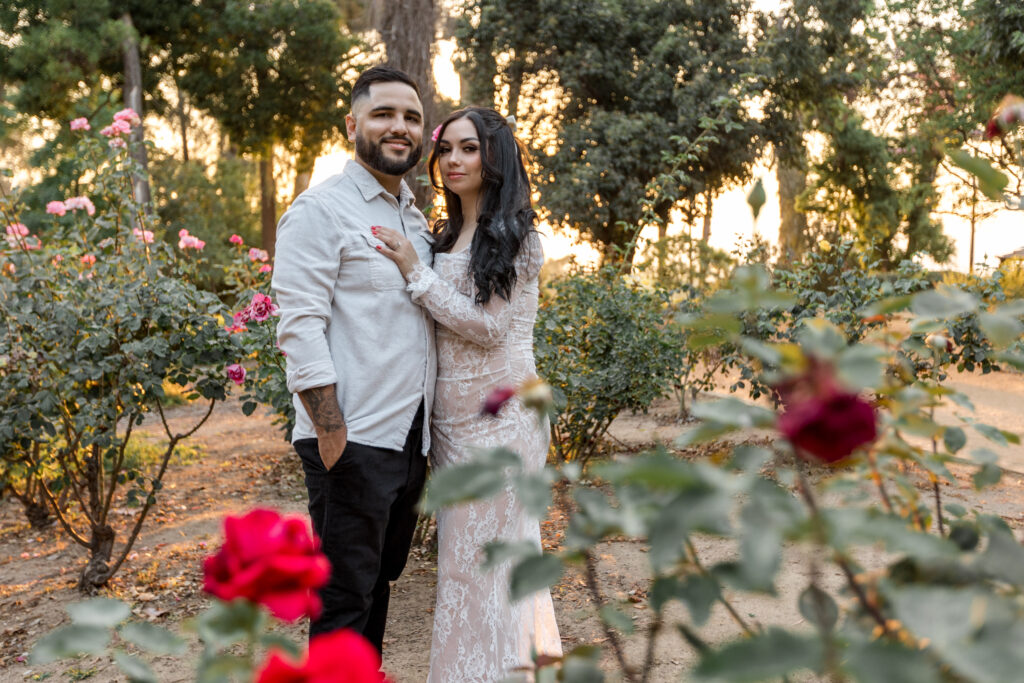 Couple standing with roses at prospect park Redlands
