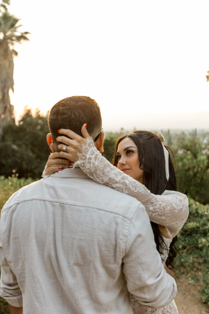 Couple having a romantic moment at their engagement session in Prospect Park Redlands