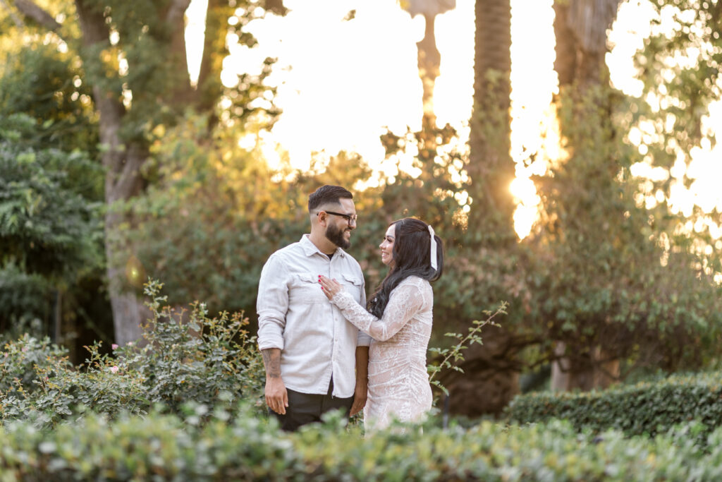 engaged couple sharing a laugh at Prospect Park in Redlands Ca