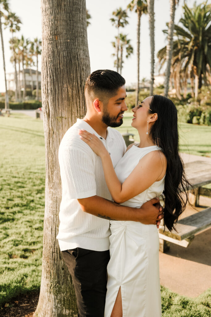 Couple in a romantic moment at Treasure Island Laguna Beach Engagement Session
