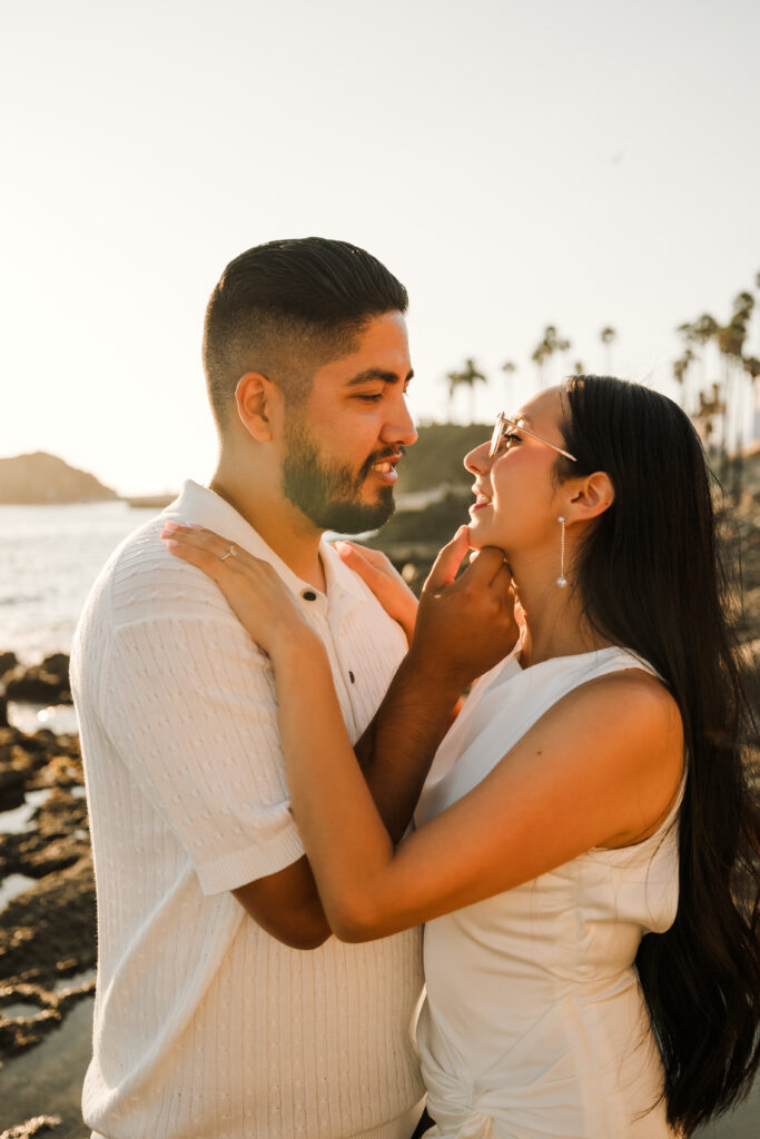 Romantic moment of couple at engagement session at Treasure Island