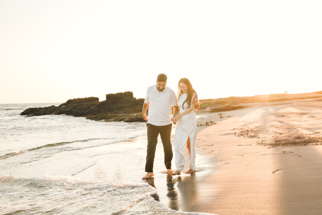 Couple having a romantic walk on the shores of Laguna Beach