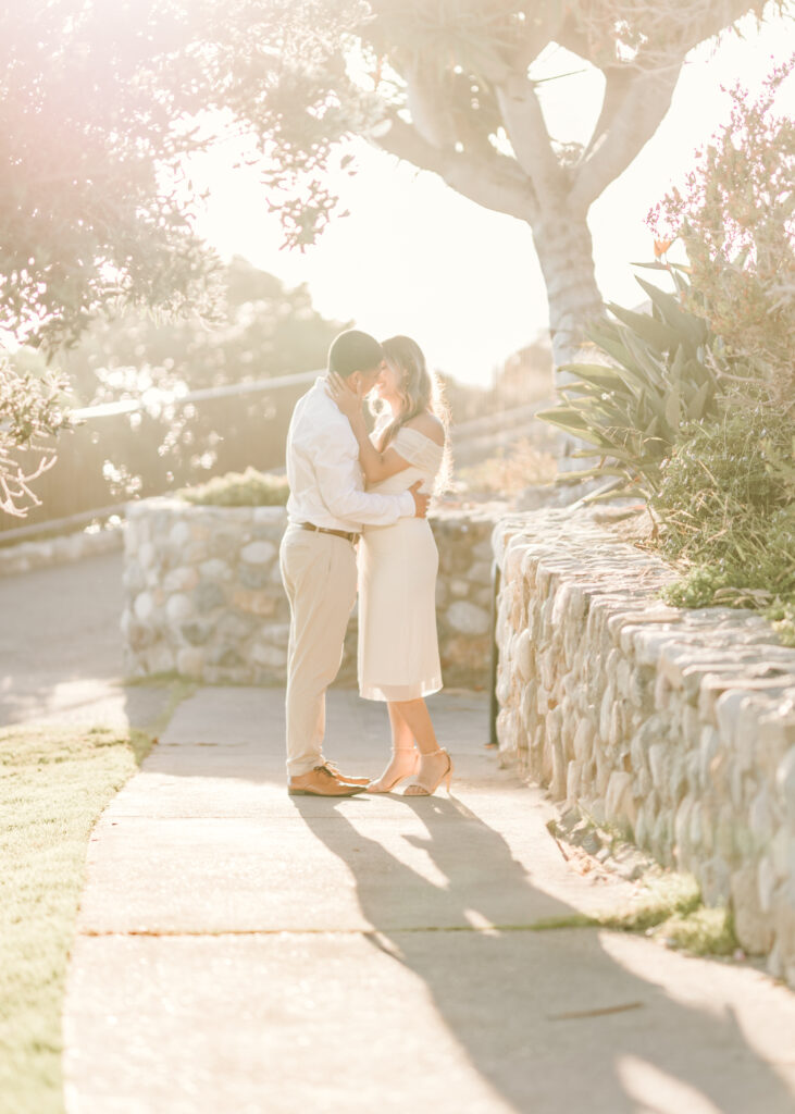 Romantic couple sharing a kiss on the Pathways of Treasure Island