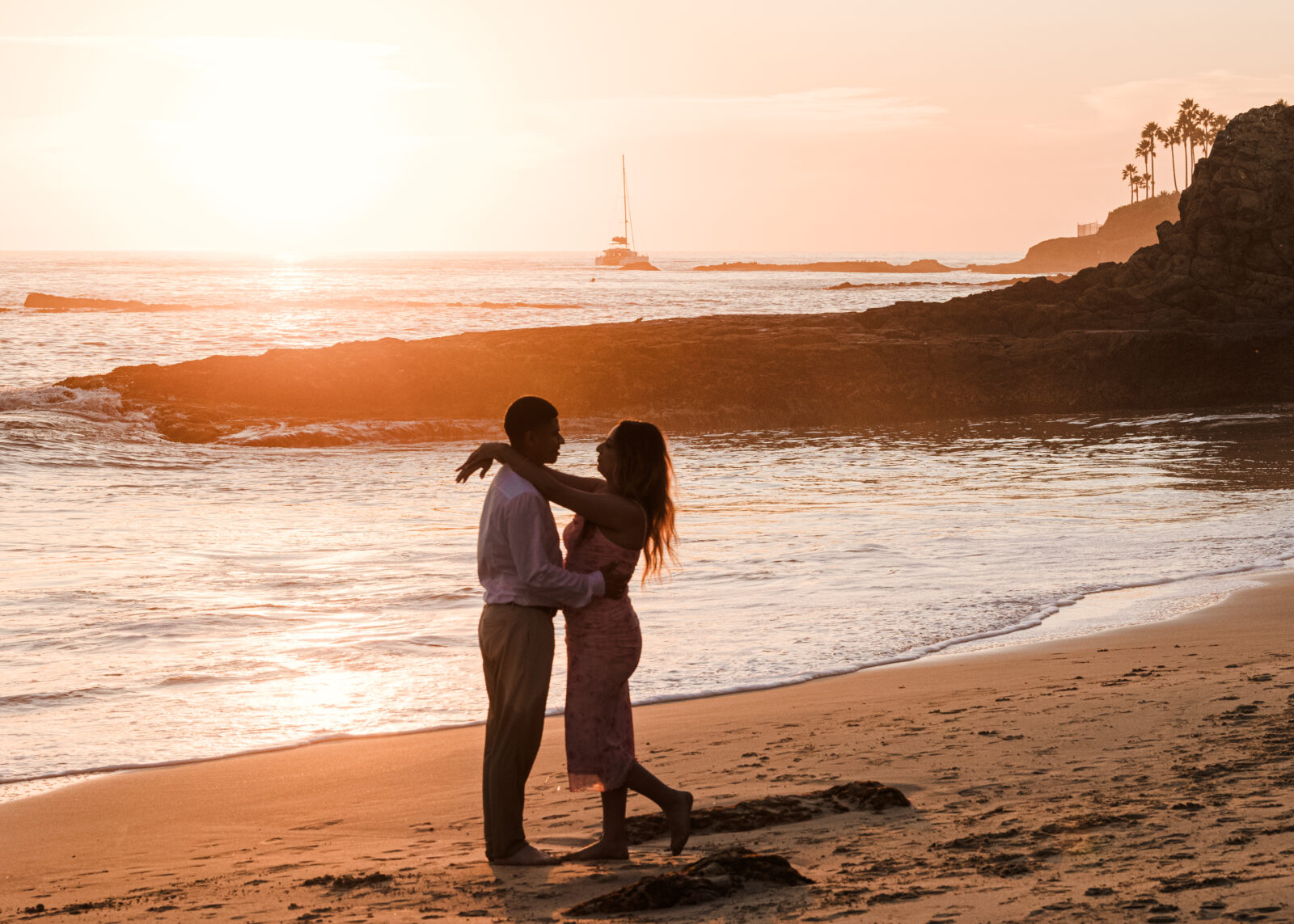 Silhouette of engaged couple at laguna beach