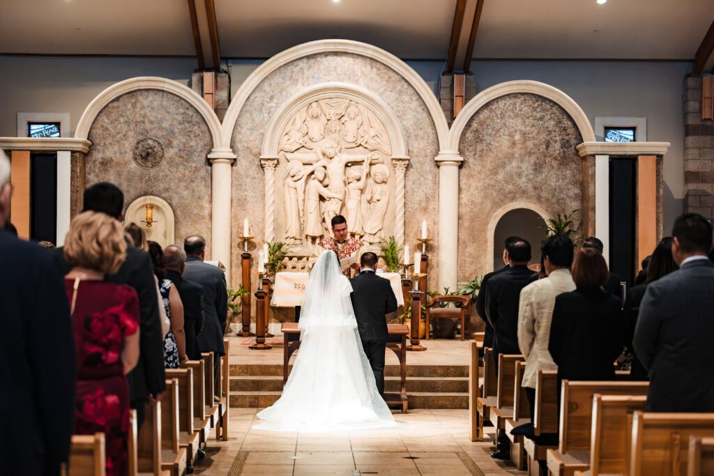 Bride and Groom at the Alter at St Martha's Catholic Parish in Murrieta Ca