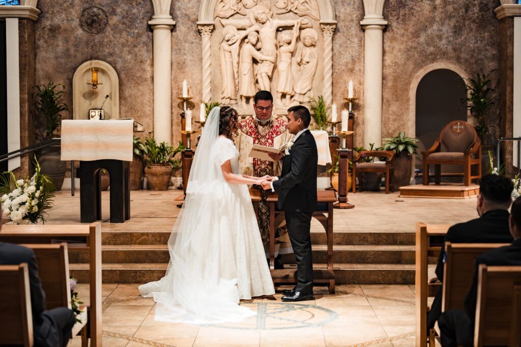 Bride and Groom at the Alter at St Martha's Catholic Parish in Murrieta Ca