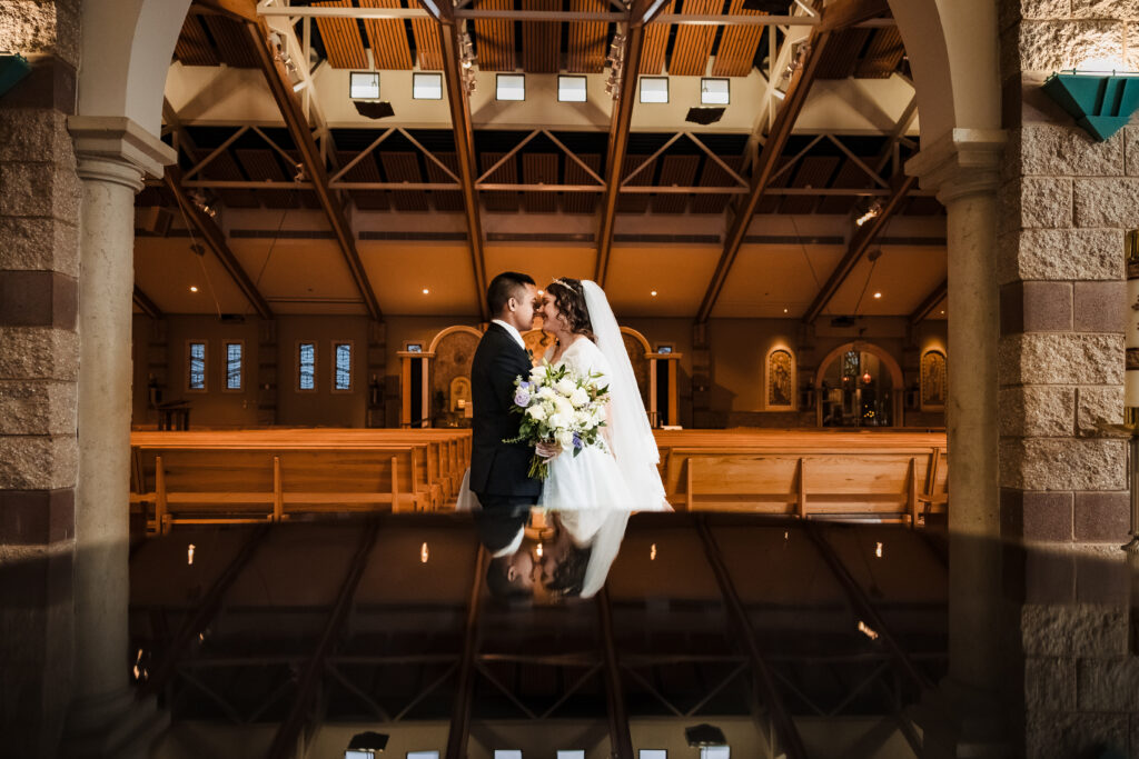 Husband and wife wedding portrait  at St Martha's Catholic Parish in Murrieta Ca